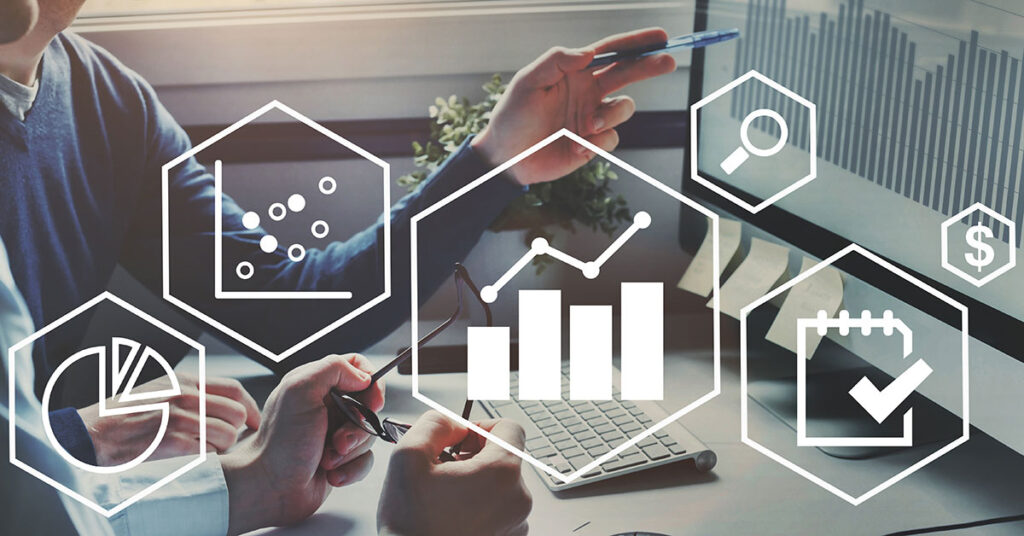 image showing graphics of charts and tables overlaid on a photo of two people working in front of a computer screen